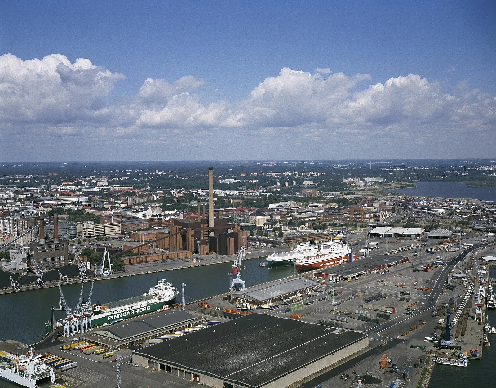 Aerial view of Helsinki port showing Finncarriers vessel, power plant, and Finnlines passenger ferries