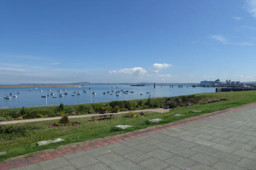 Holyhead harbour panorama on a sunny day with marina sailboats and cruise ship in the distance
