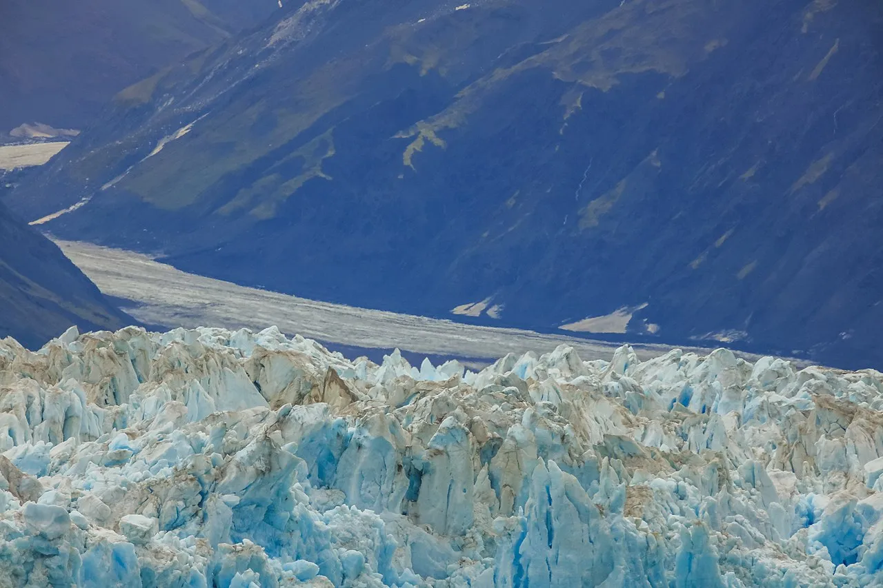 Hubbard Glacier seracs and ice formations with mountain backdrop