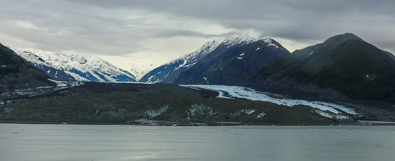 Panoramic view of Hubbard Glacier stretching across Yakutat Bay with mountains behind
