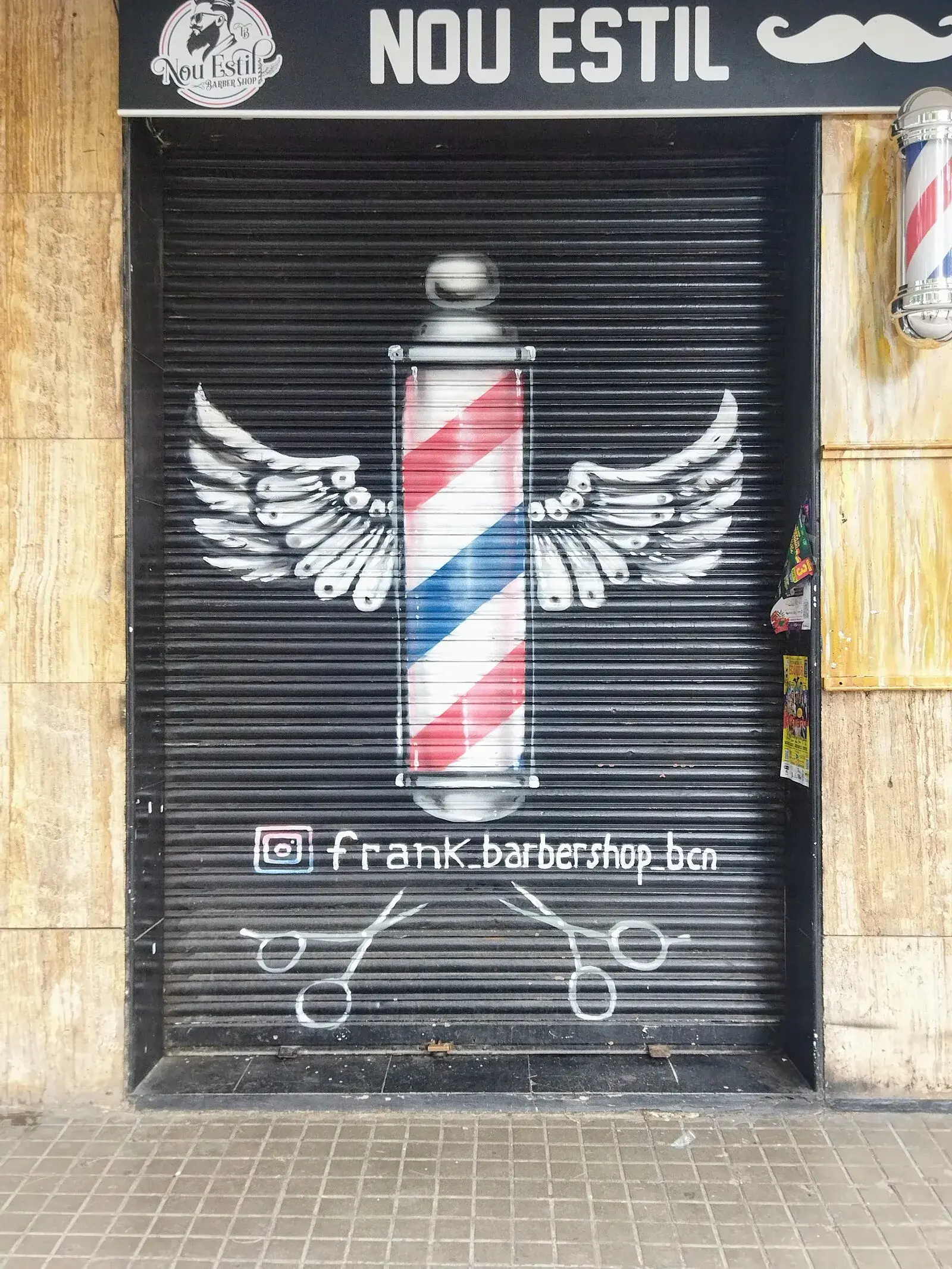 Traditional Ibizan whitewashed farmhouse with flat roof and thick stone walls surrounded by almond and olive trees