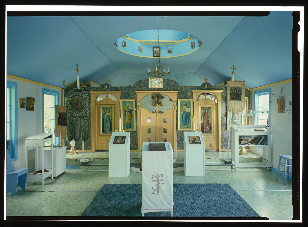 Interior of St. Nicholas Russian Orthodox Church in Hoonah with blue ceiling and iconostasis