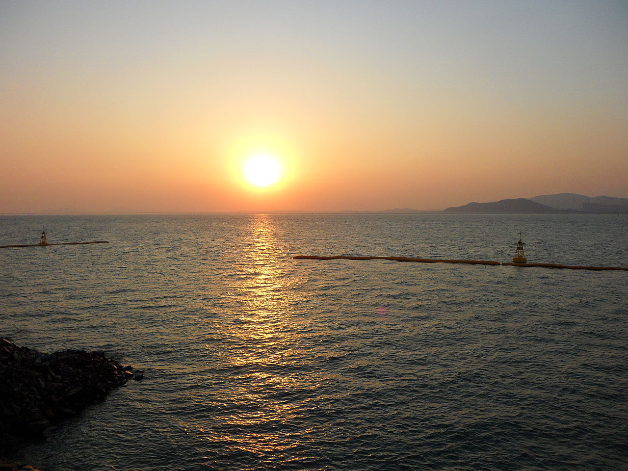 Panoramic view of Incheon harbor with container ships and cranes at the working port