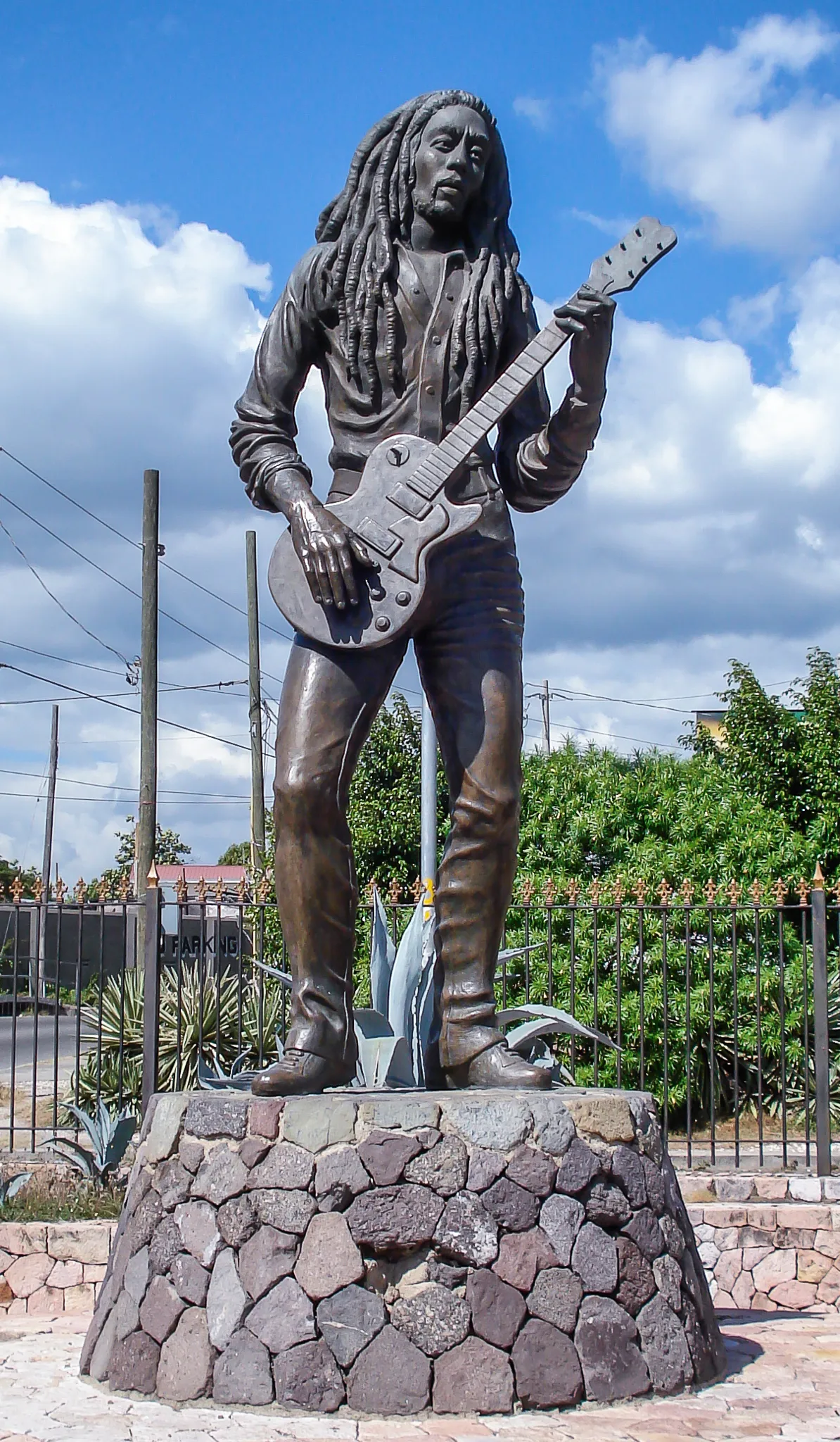 Bronze statue of Bob Marley playing guitar in Kingston, Jamaica