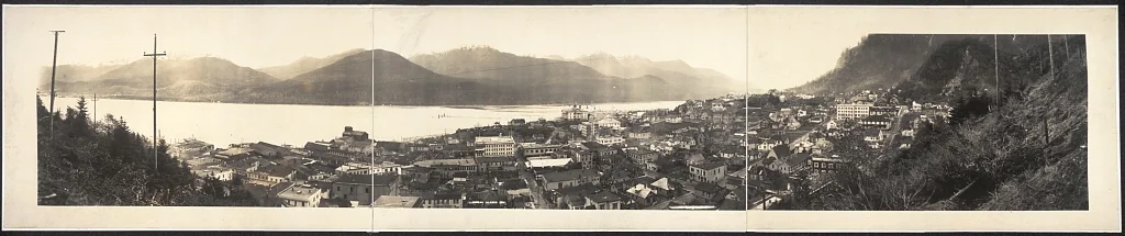 1914 panoramic photograph of Juneau, Alaska from above showing downtown, waterfront, and Gastineau Channel