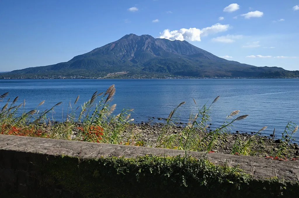 Kagoshima cruise port waterfront with docked vessels and Sakurajima in the background