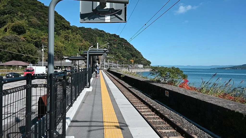 Tenmonkan covered shopping arcade with colourful signs and pedestrians in central Kagoshima
