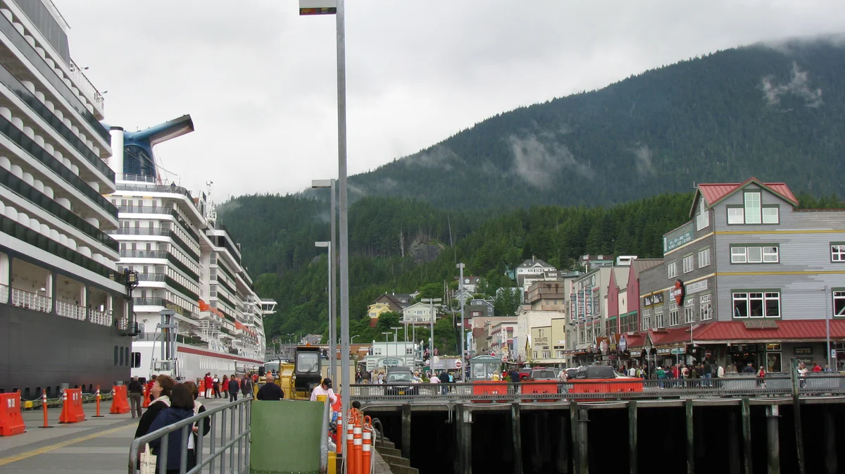 Ketchikan waterfront with cruise ships docked at port and colorful buildings along the shore