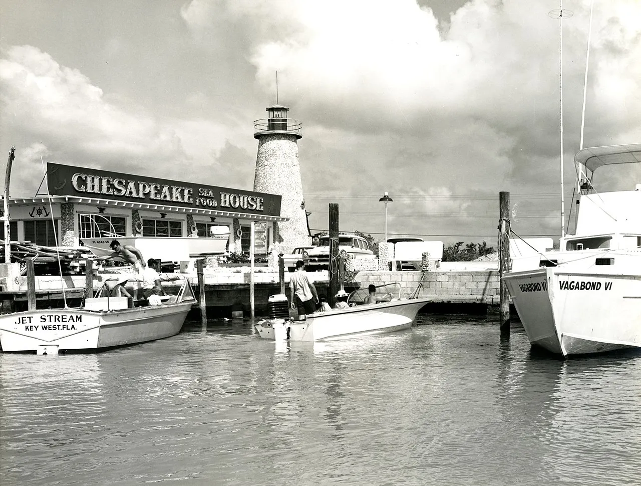 Colorful Victorian homes and palm trees line Duval Street in Key West with the signature pastel architecture of the Conch Republic