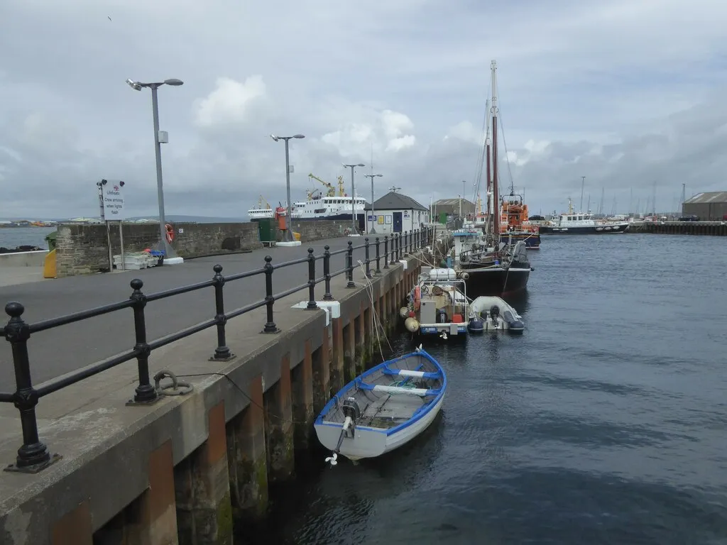 Kirkwall harbor quay with RNLI lifeboat and ferry in background