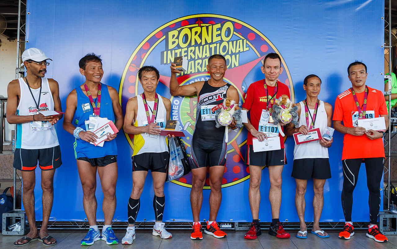 Aerial view of tropical islands dotting the turquoise South China Sea near Kota Kinabalu coastline