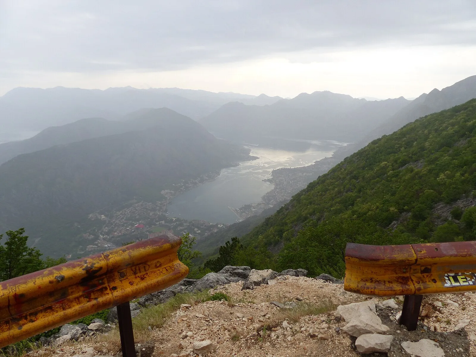 Interior of the Cathedral of Saint Tryphon in Kotor showing Romanesque stone columns and medieval frescoes