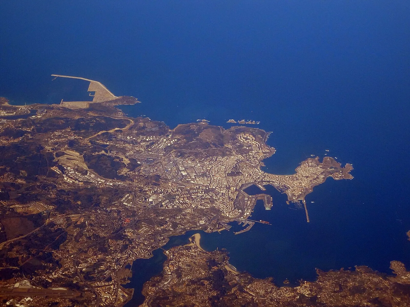 Aerial view of A Coruña peninsula showing harbor, port, and coastline