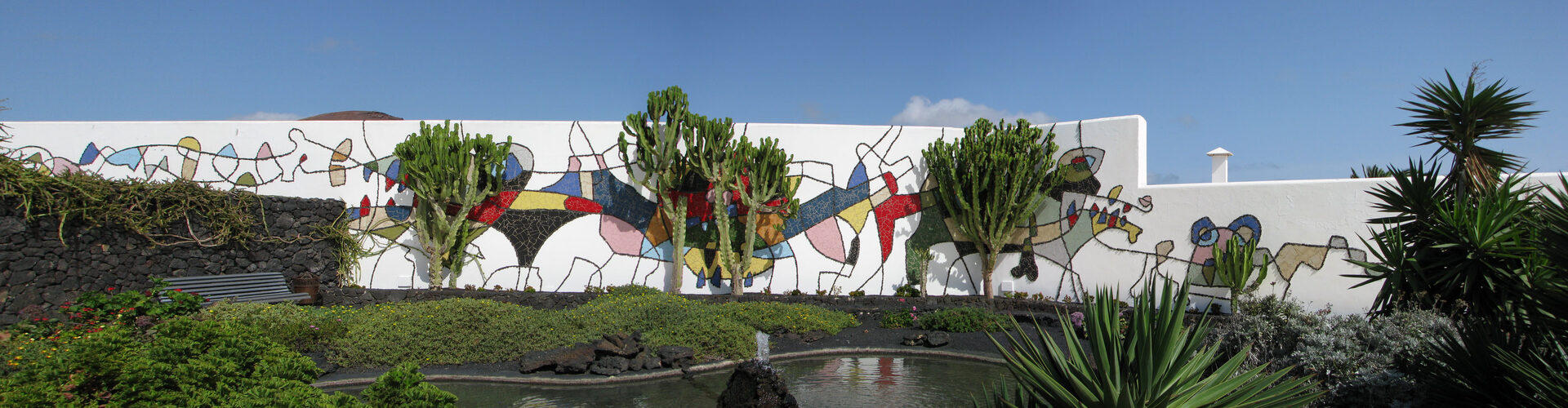 Cueva de los Verdes volcanic lava tube interior with dramatic lighting revealing ancient rock formations and cave pathways