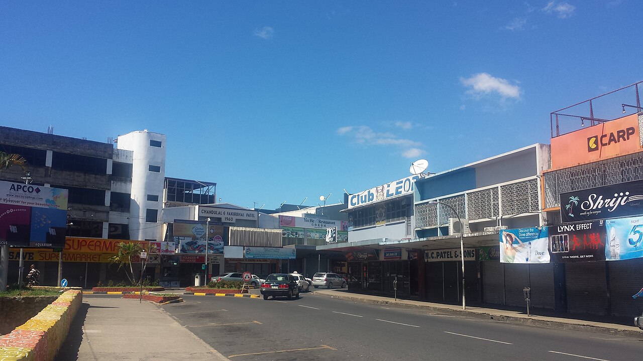 Street scene in bustling Lautoka town with local shops and pedestrians