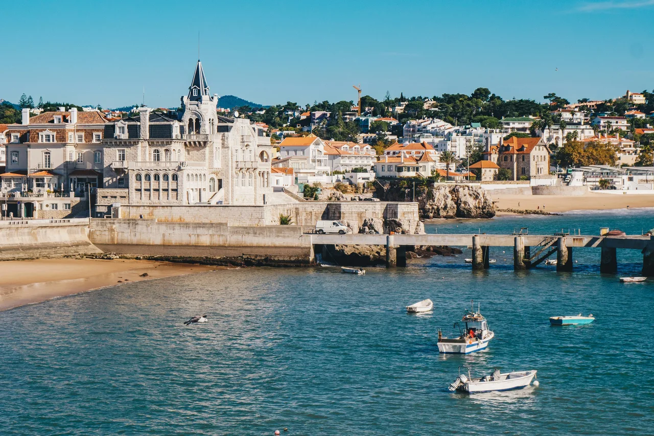 Cascais harbor with fishing boats and ornate waterfront buildings