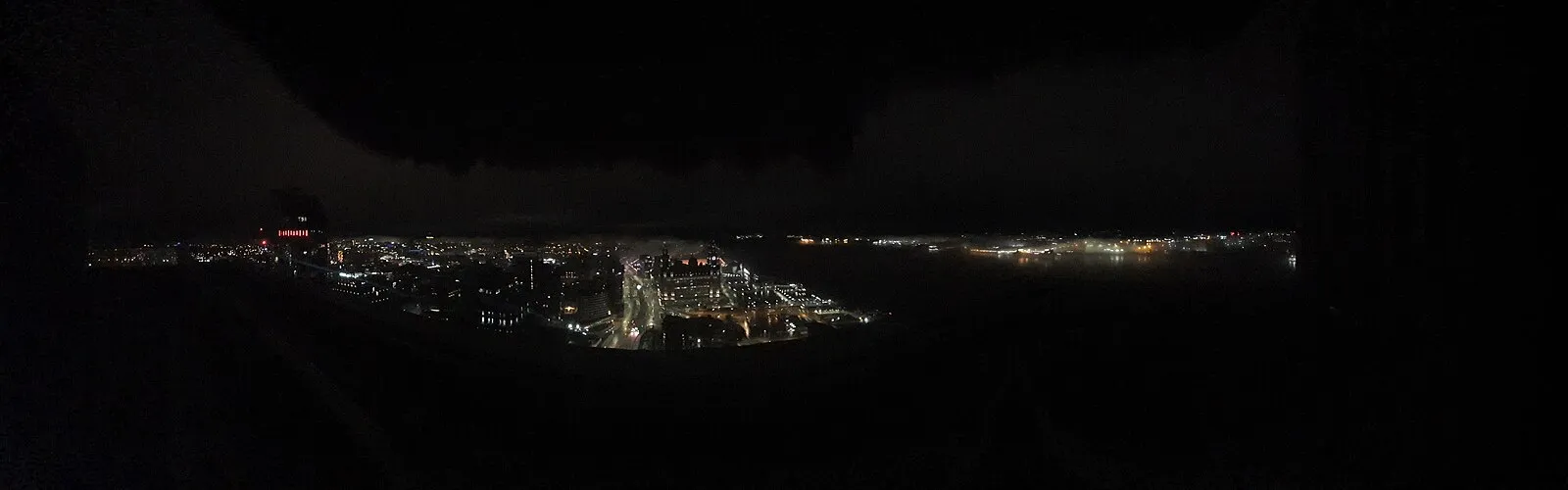 Interior architecture of Liverpool Anglican Cathedral showing the vast nave and stained glass windows