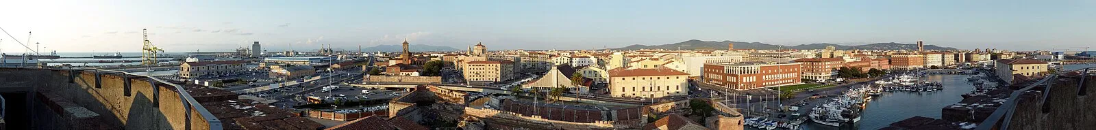 Livorno cruise terminal with a large cruise ship docked at the pier