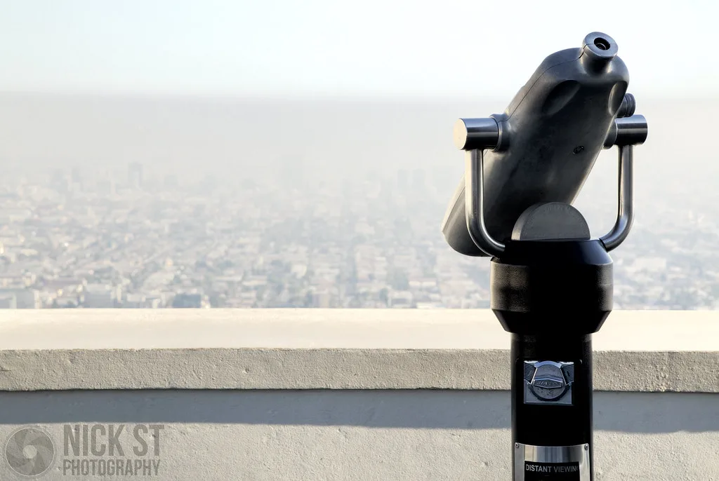 Iconic Los Angeles landmark with palm trees and clear skies