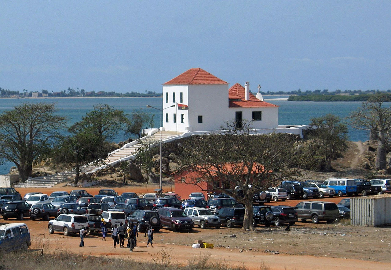 Mercado do Benfica open-air market with colorful produce stalls in Luanda