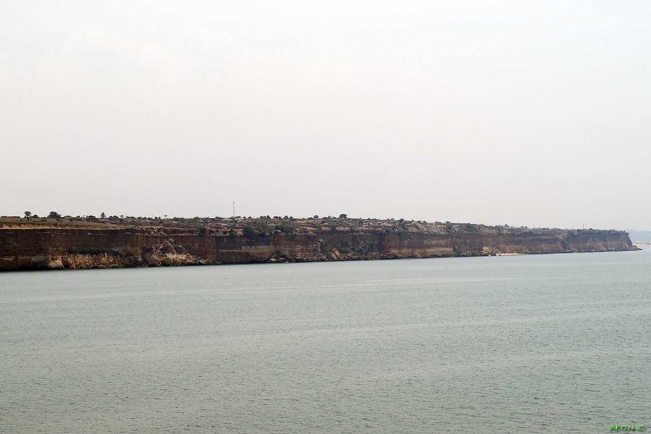 The Marginal waterfront promenade with palm trees and modern Luanda skyline