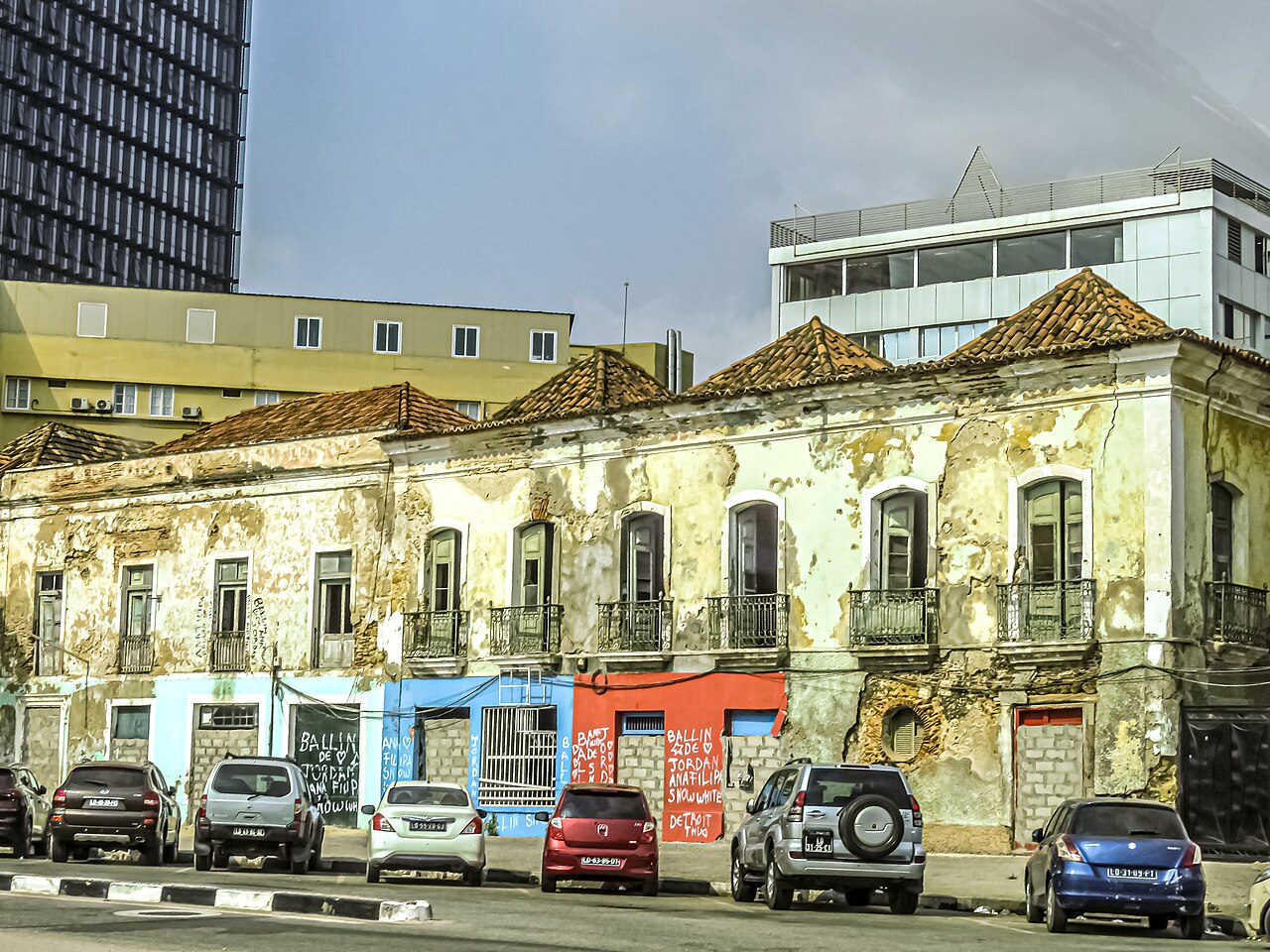 Street scene in Luanda with pedestrians and Portuguese colonial buildings