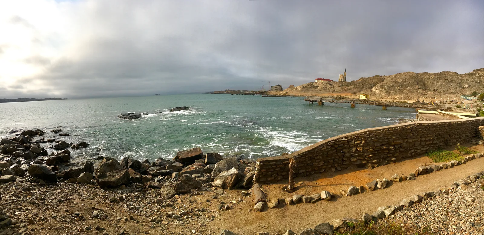 Panorama of Lüderitz bay with the town along the shore and the Felsenkirche on the skyline above it