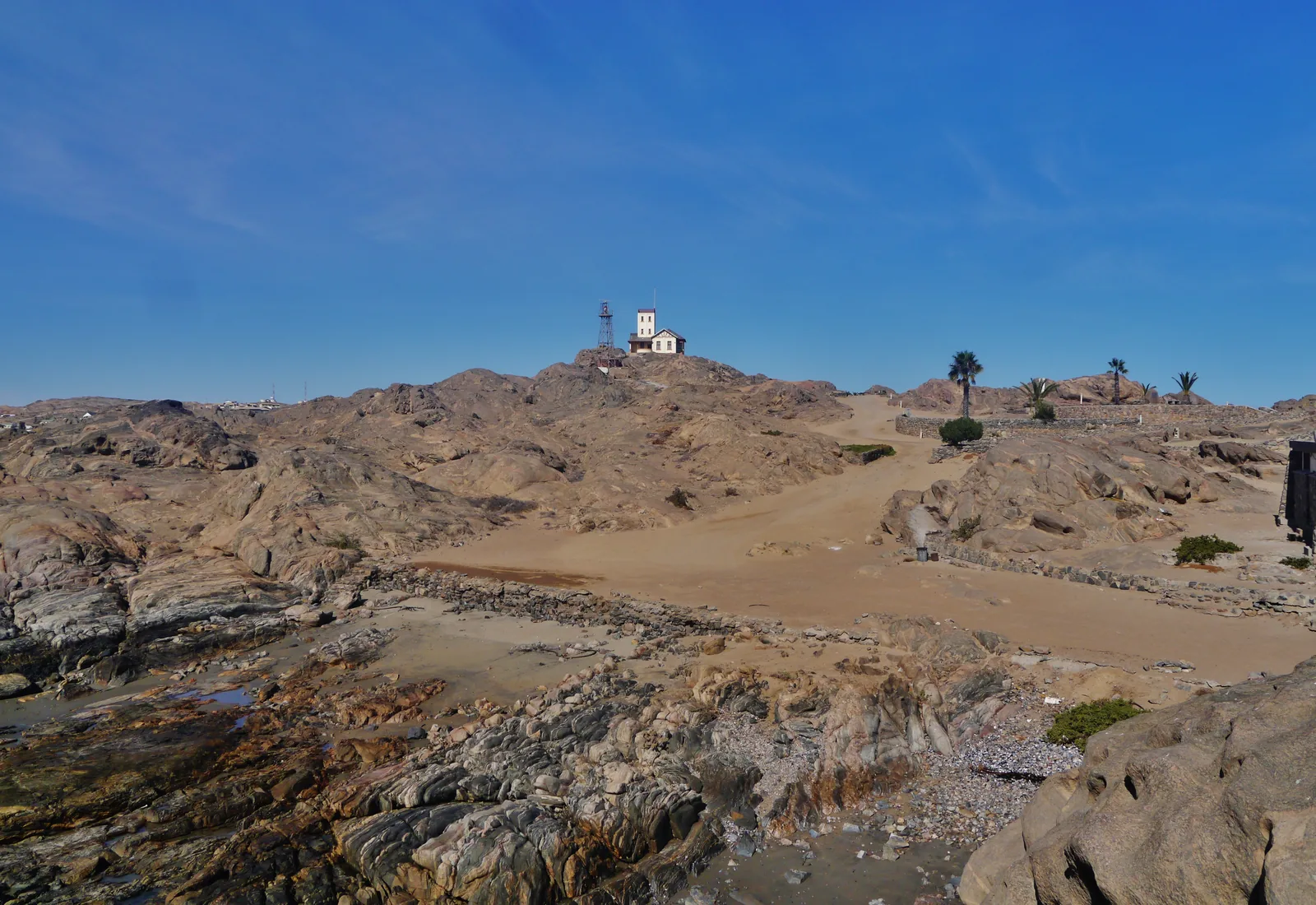 Shark Island at Lüderitz, a low rocky peninsula joined to the town, seen across the water