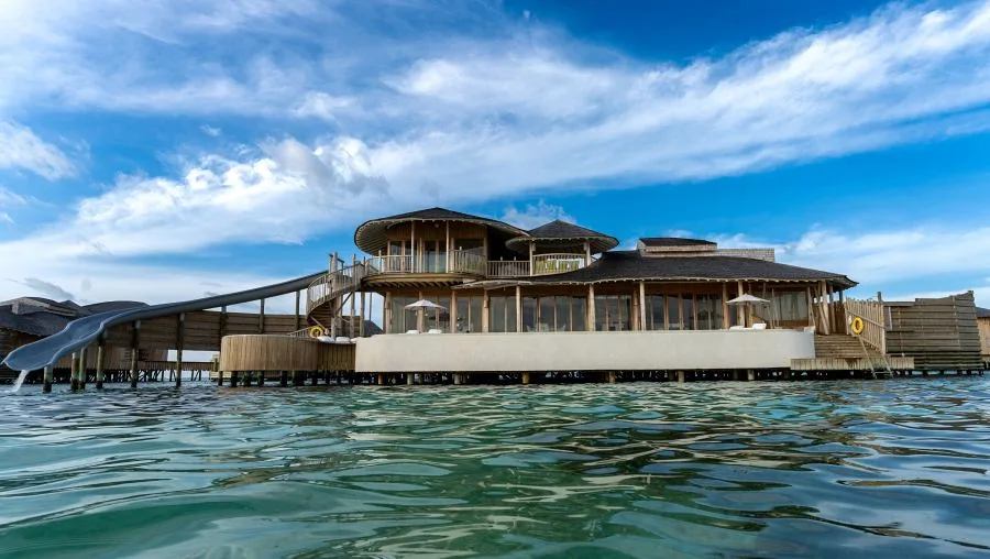 Traditional dhoni boats moored in the bustling Male harbor at sunrise
