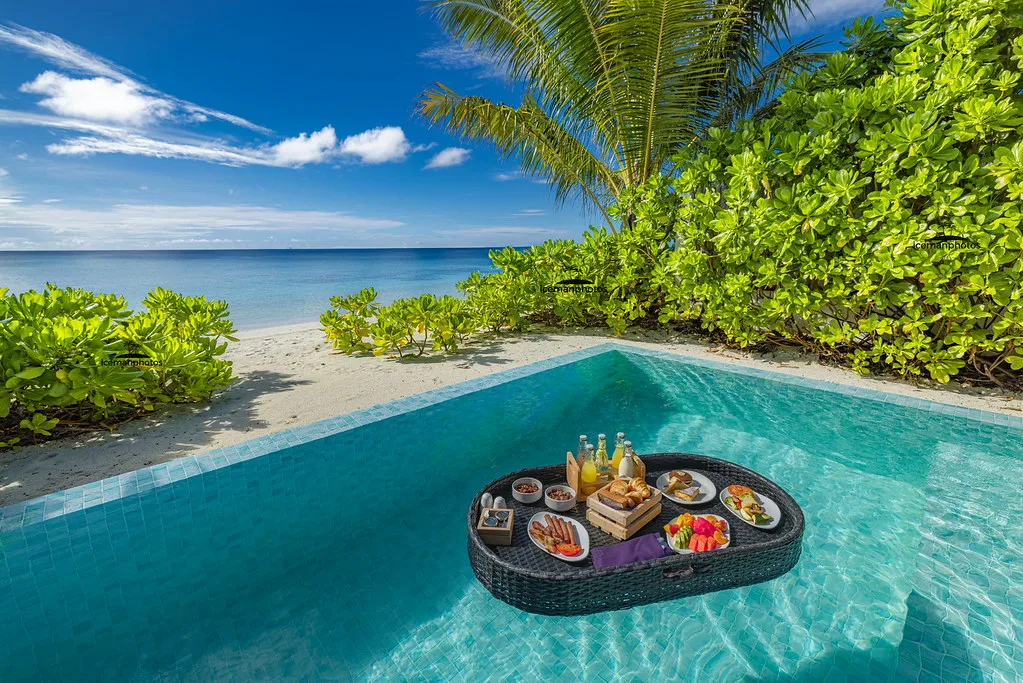 Crystal-clear turquoise lagoon and overwater bungalows in the Maldives archipelago