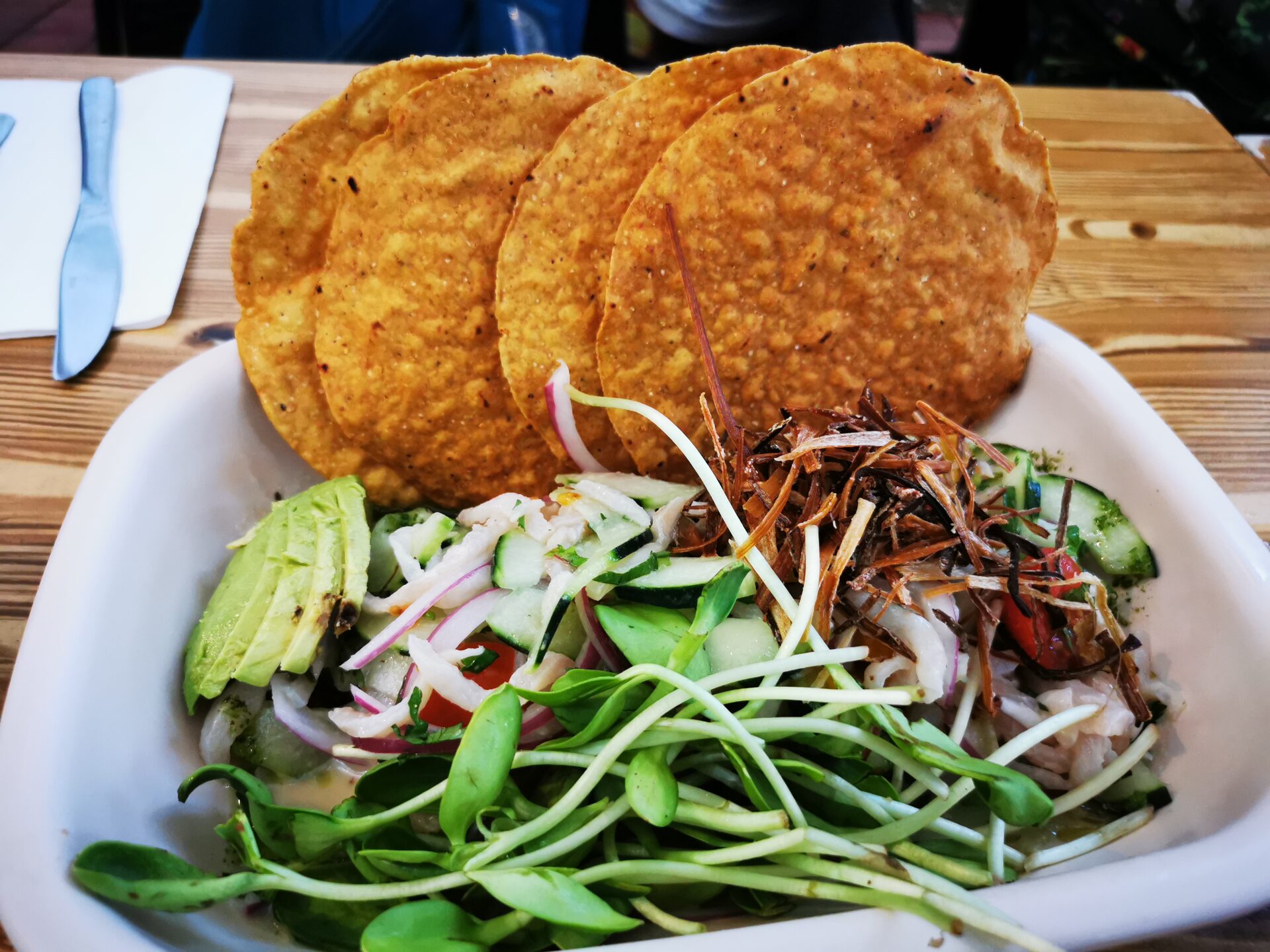 Sportfishing boat with sailfish flags flying from outriggers returning to Manzanillo marina at sunset