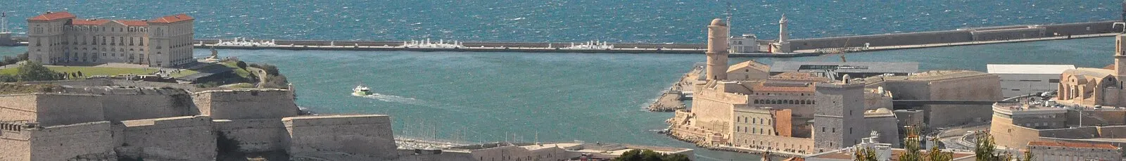 Marseille harbor entrance with Fort Saint-Jean, breakwater, and boat
