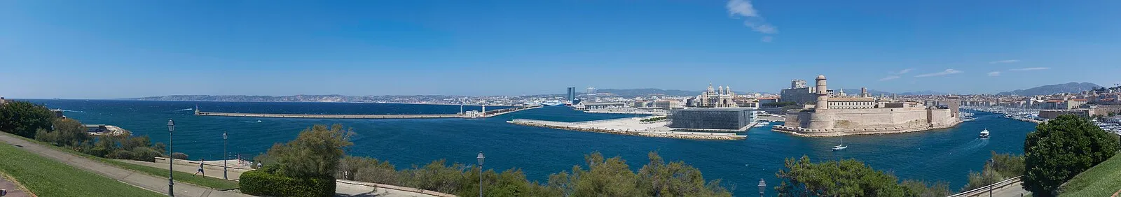 Wide panoramic of Marseille harbor, Fort Saint-Jean, MuCEM, and city
