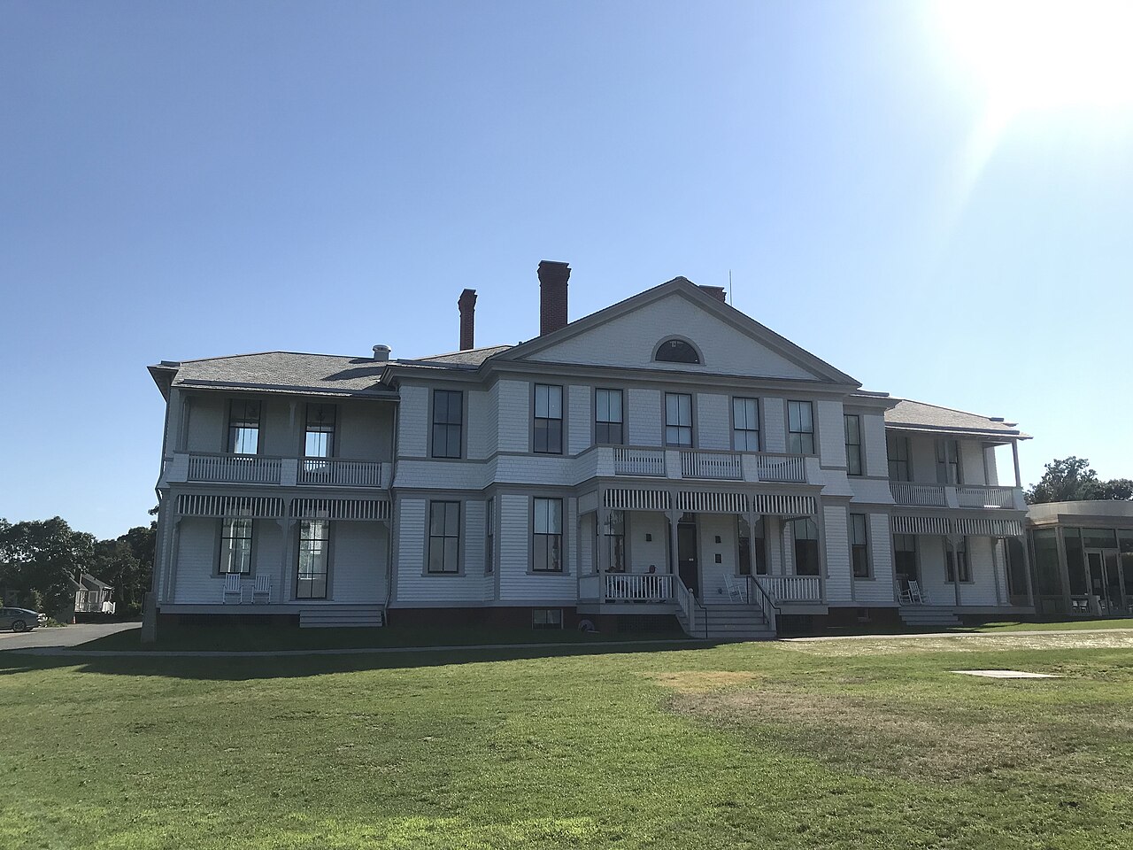 White New England colonial building with wraparound porches on Martha's Vineyard