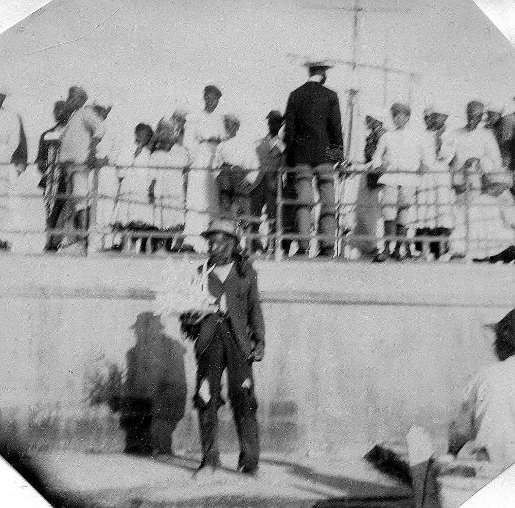 Fort-de-France harbor with colorful colonial buildings and lush green mountains of Martinique rising in the background