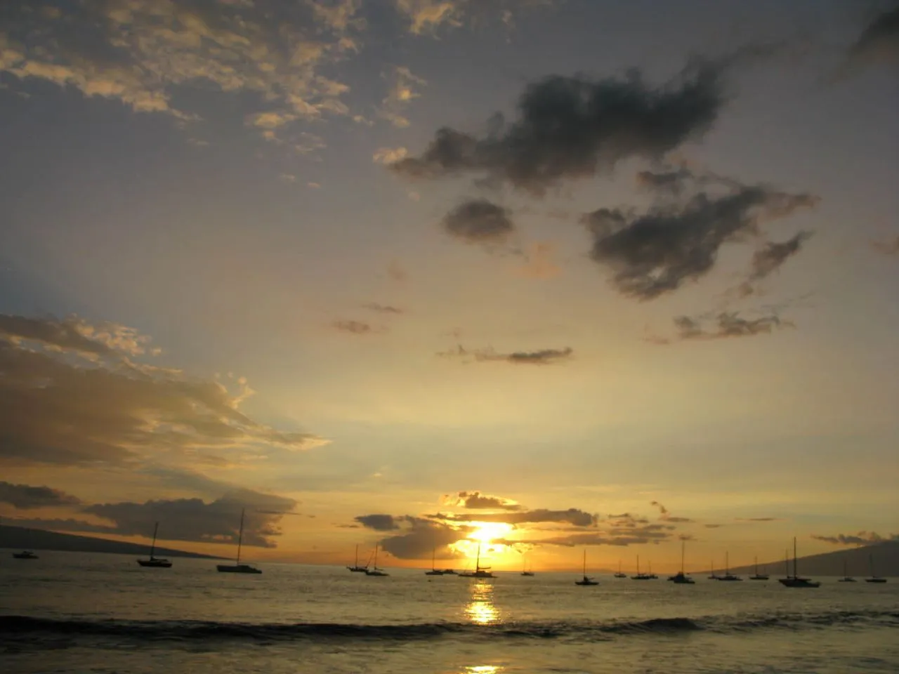 Haleakala crater at sunrise with rust-red cinder cones and silver light
