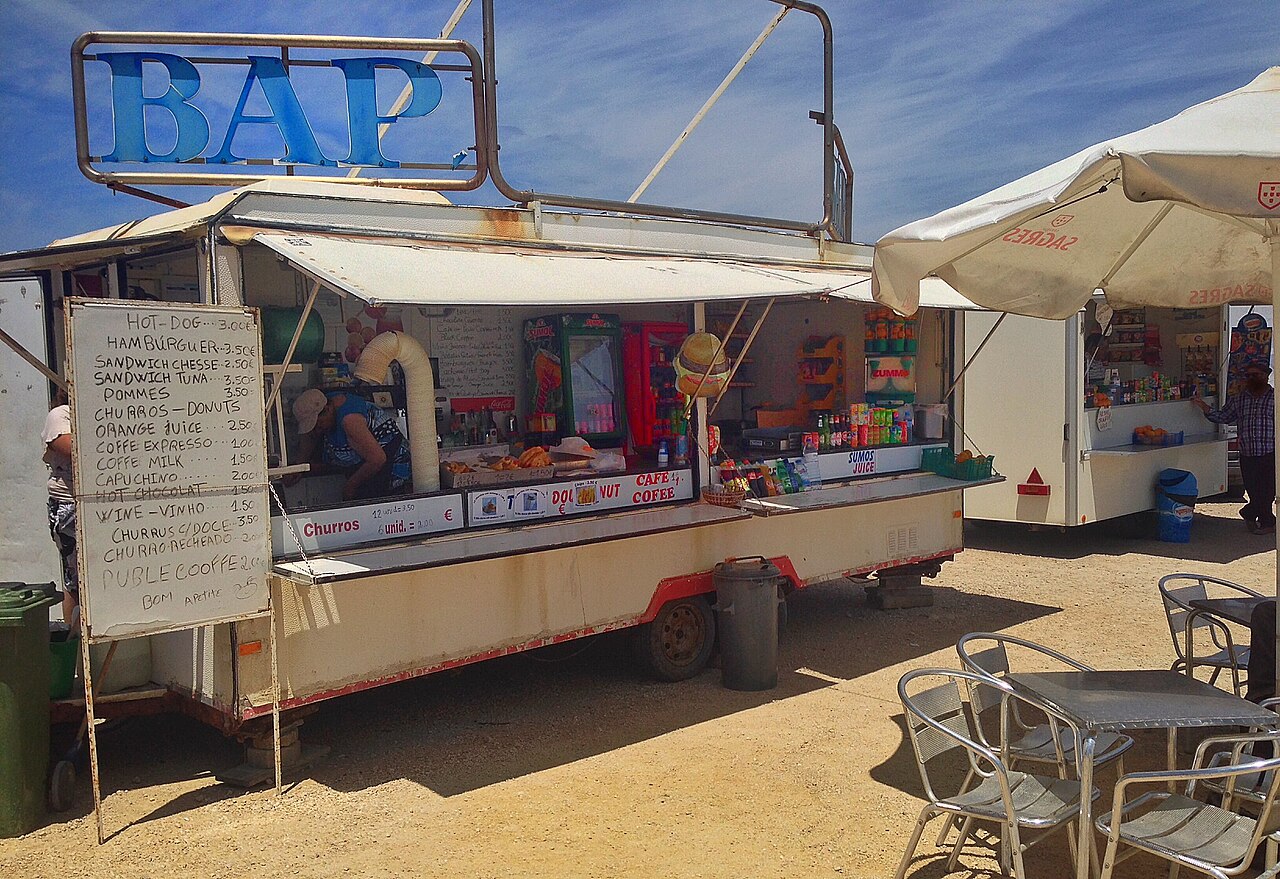 Fresh grilled fish served on a plate at the Mindelo fish market with lime and local accompaniments