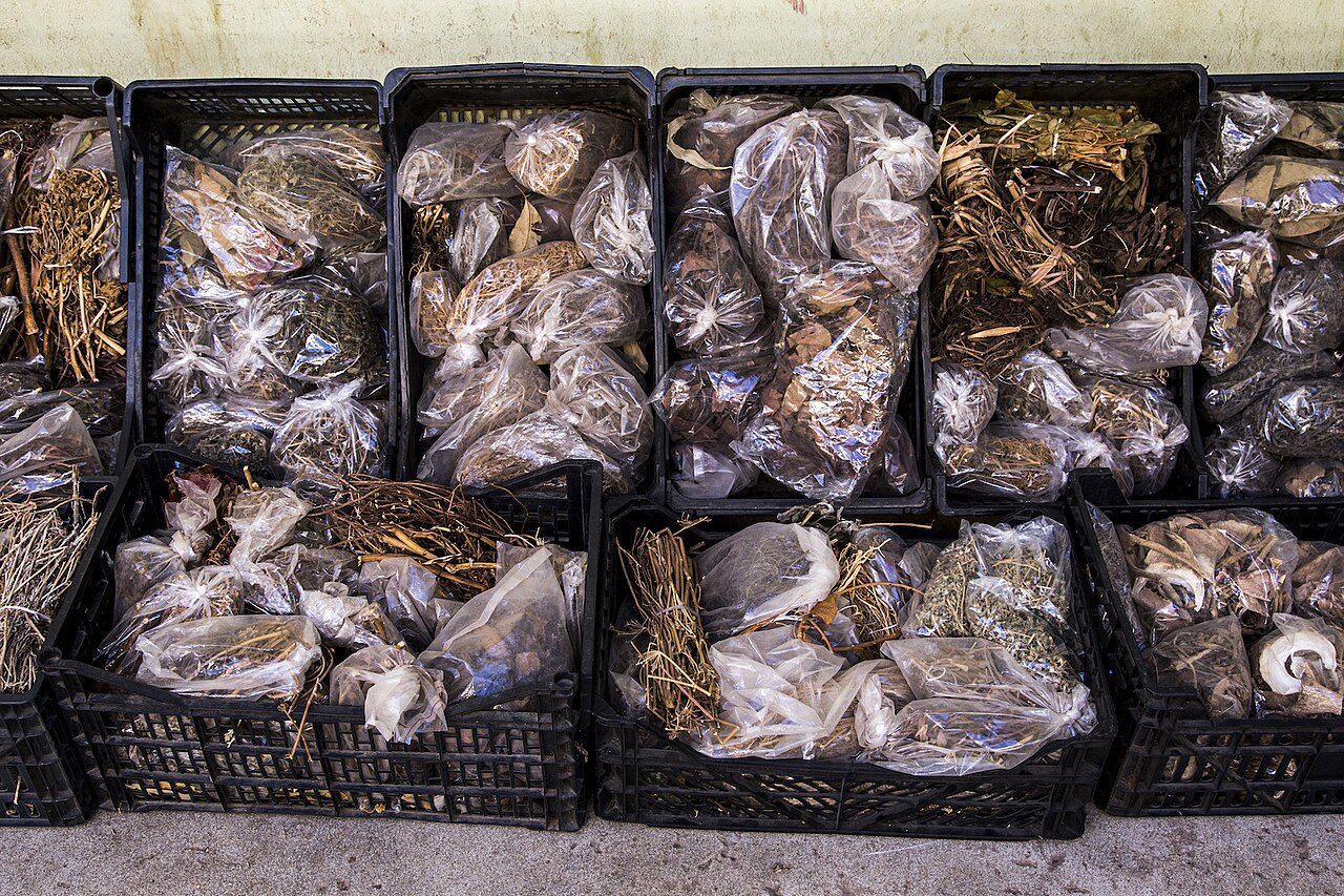 Sandy stretch of Laginha Beach with calm turquoise water and volcanic hills framing the bay