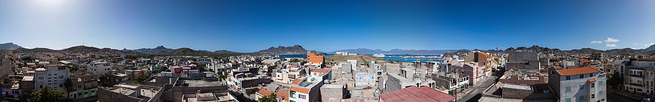 Sweeping panoramic view from Monte Verde summit showing Mindelo, Porto Grande bay, and neighboring islands on the horizon