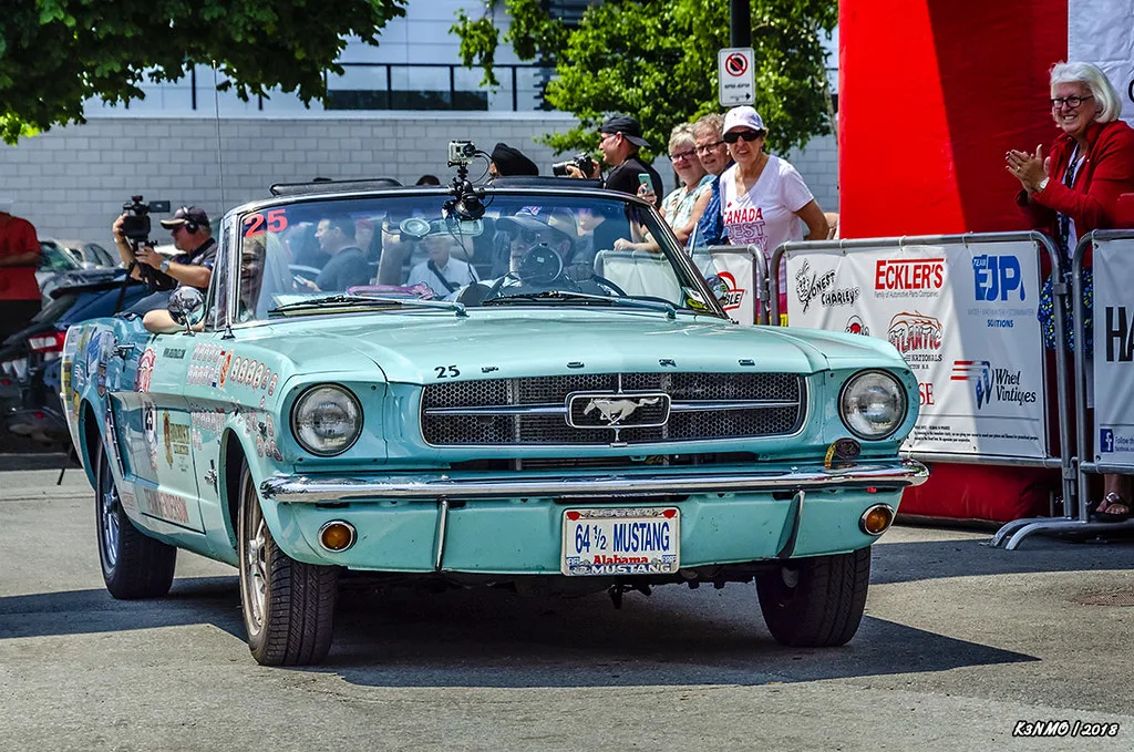 Bellingrath Gardens with blooming azaleas reflected in Mirror Lake surrounded by cypress trees