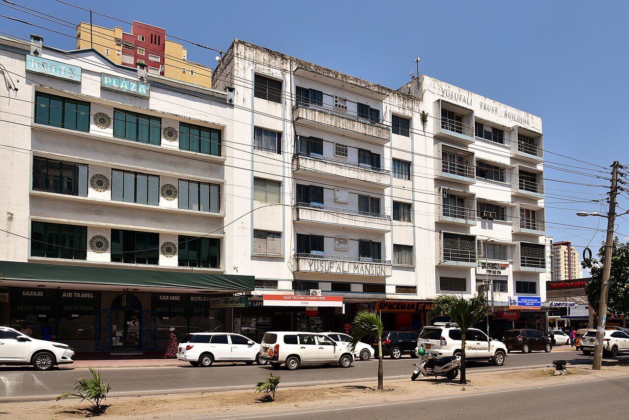 Bustling Moi Avenue in central Mombasa with the iconic aluminum tusks visible in the distance