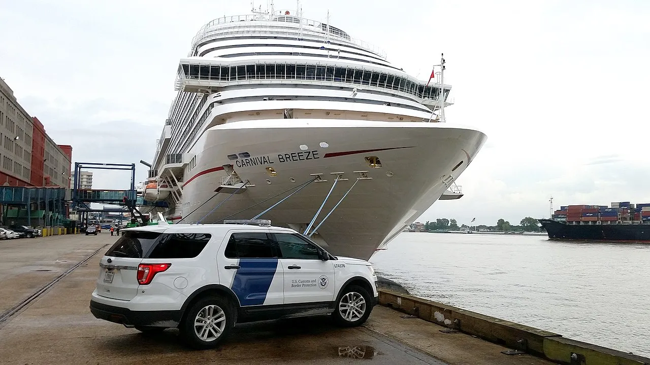 Carnival Breeze docked at New Orleans cruise terminal with CBP vehicle