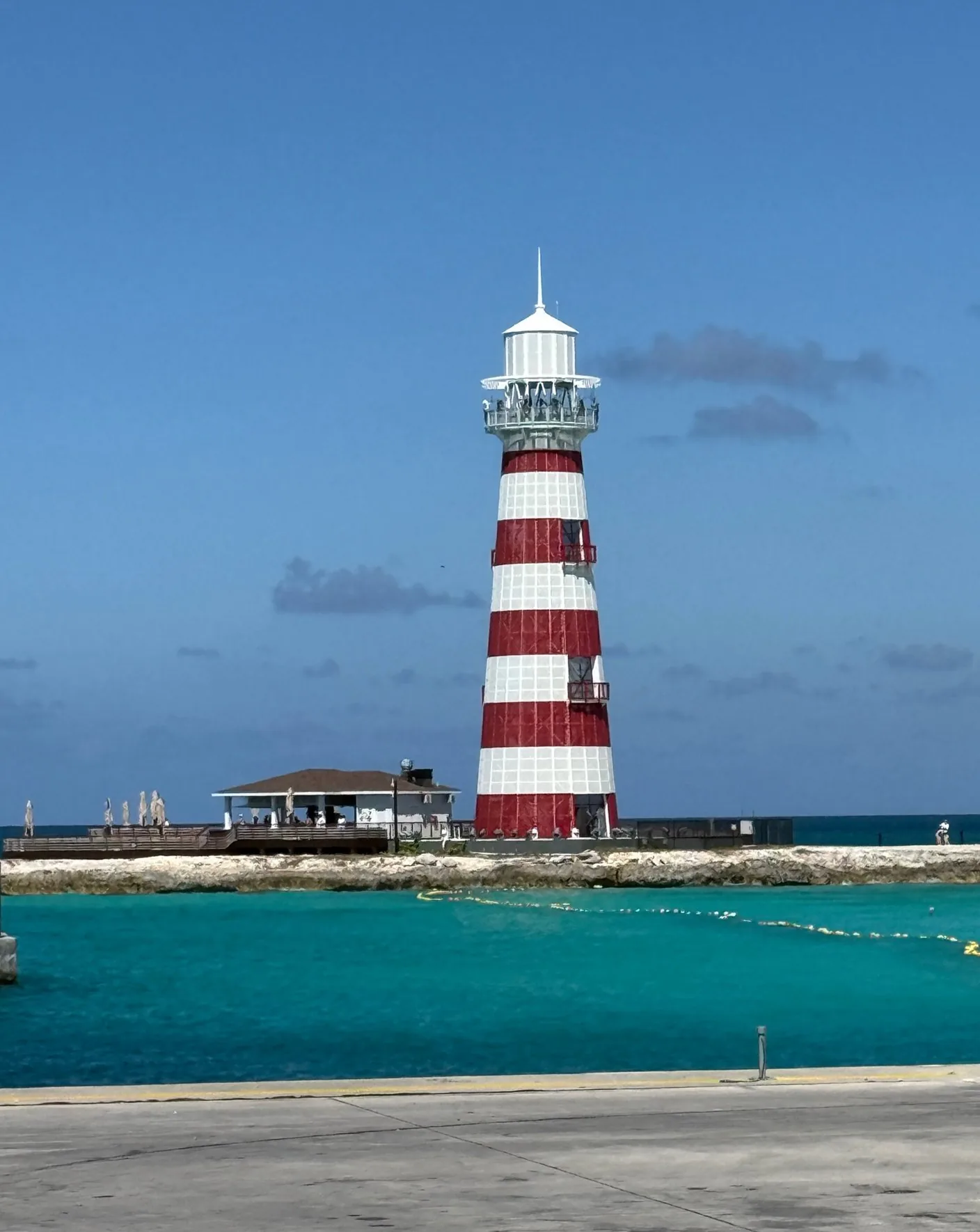 Ocean Cay lighthouse and Lighthouse Bar pavilion seen across the cruise pier channel