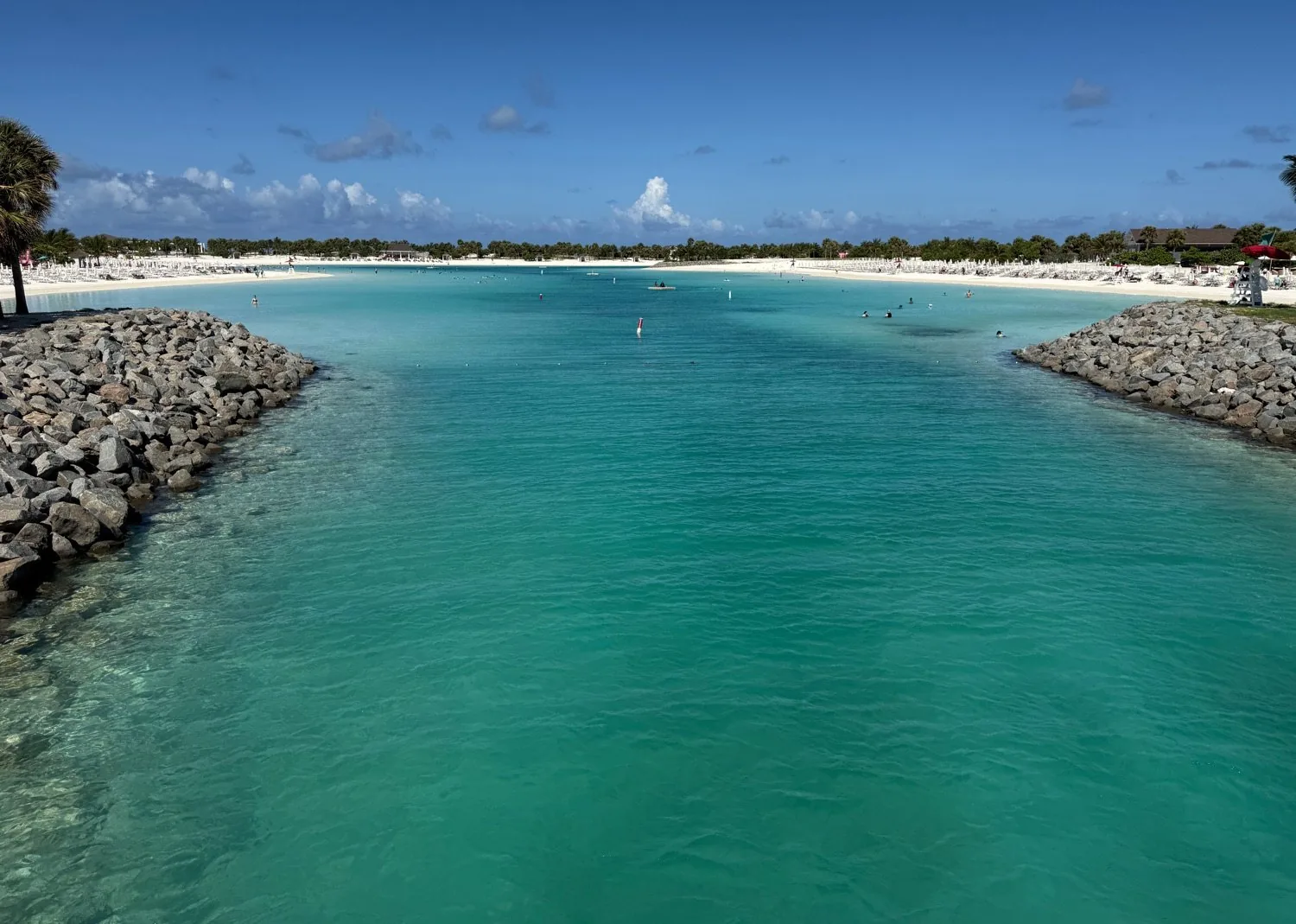 Stone breakwater opening framing the engineered Ocean Cay swim lagoon