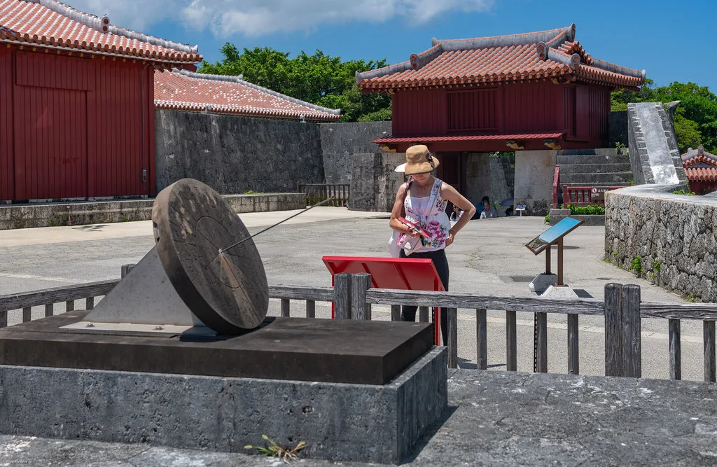 Traditional Okinawan Eisa dancers in colorful costumes performing on a festival stage