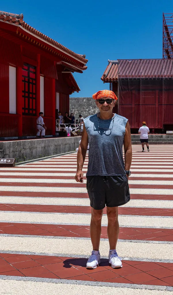 Turquoise ocean waters and white sand beach along the western coast of Okinawa island