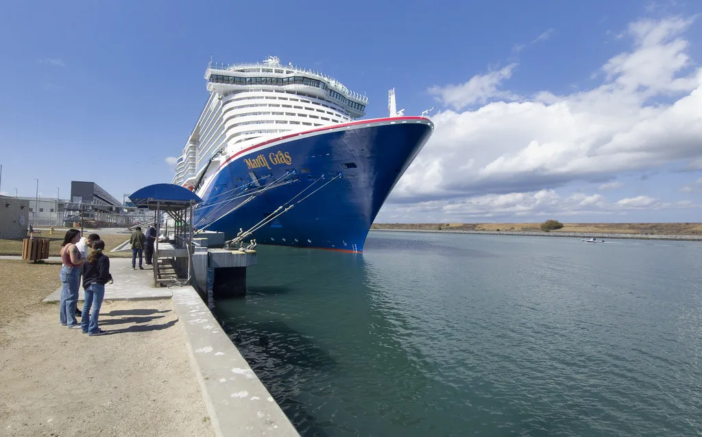 Port Canaveral cruise terminal with rocket launch pads visible in the distance
