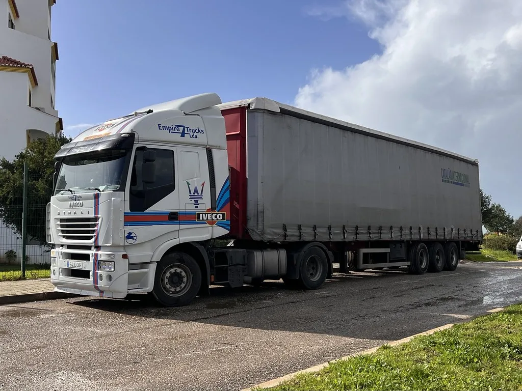 Benagil Sea Cave interior with sunlight streaming through the circular roof opening
