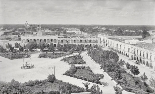Colorful colonial buildings and central plaza in Merida's historic district with outdoor cafes