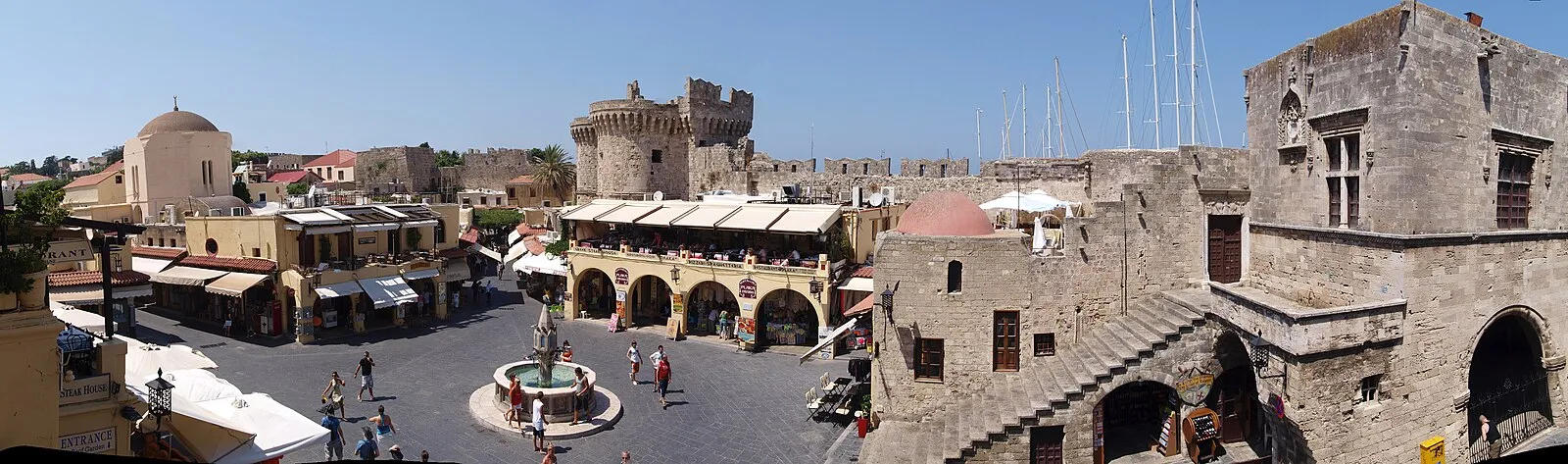 Rhodes Old Town Hippocrates Square with Castellania building and medieval tower